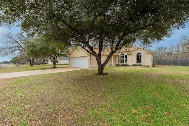 ranch-style home with a garage and a front lawn