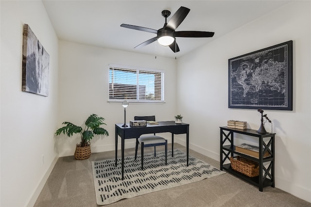 office with carpet floors and ceiling fan