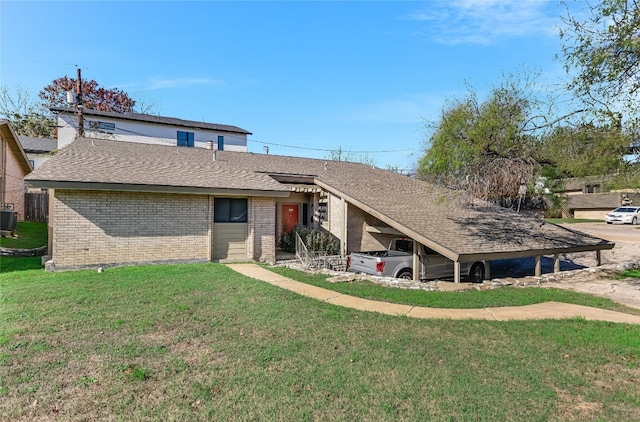 ranch-style house with central AC unit and a front yard