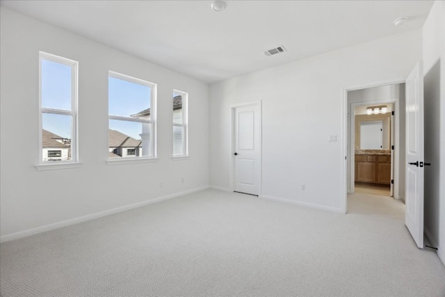 unfurnished bedroom with light carpet