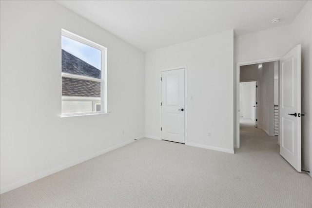 unfurnished bedroom with light carpet