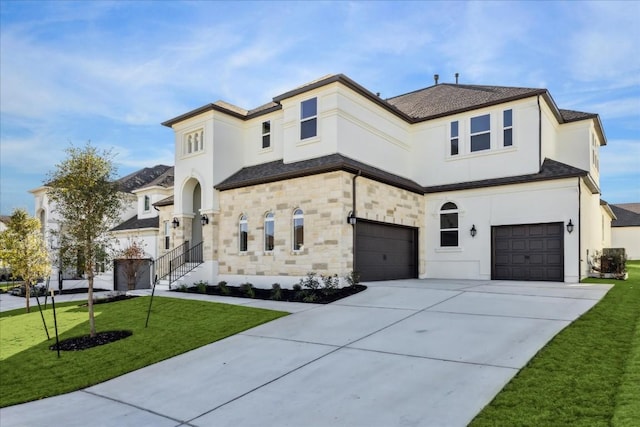 mediterranean / spanish home with cooling unit, a front lawn, and a garage