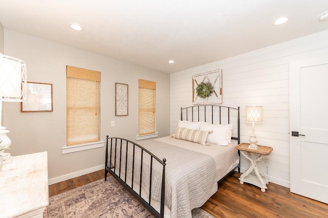 bedroom with dark wood-type flooring