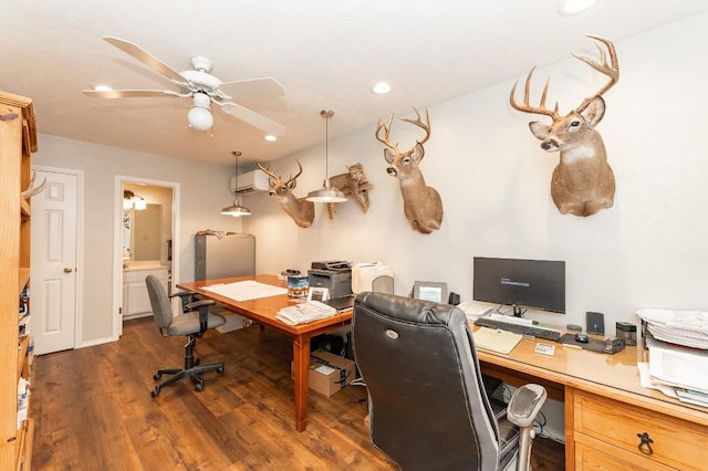 home office featuring ceiling fan, dark hardwood / wood-style flooring, and a wall unit AC