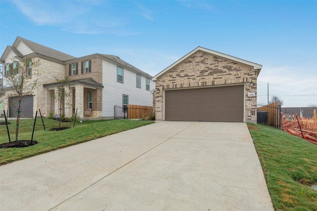 view of front facade featuring a front yard and a garage