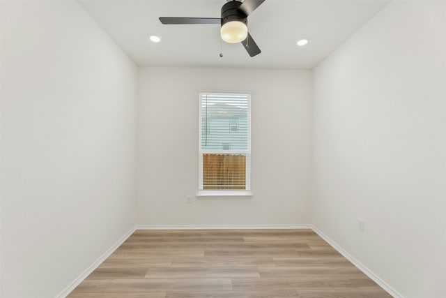 unfurnished room featuring light hardwood / wood-style flooring and ceiling fan