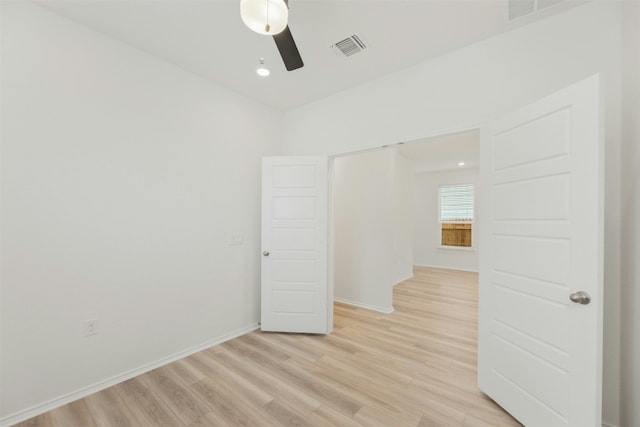 unfurnished room featuring ceiling fan and light hardwood / wood-style floors