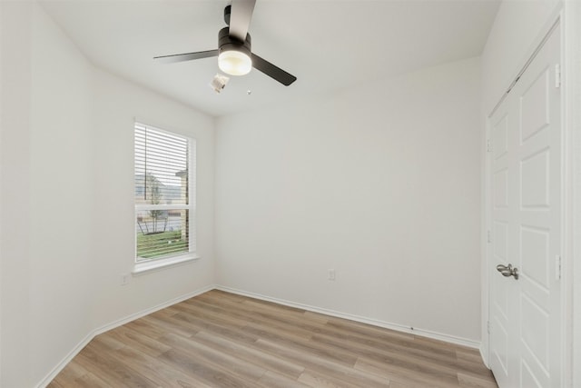 unfurnished bedroom with multiple windows, light wood-type flooring, and ceiling fan