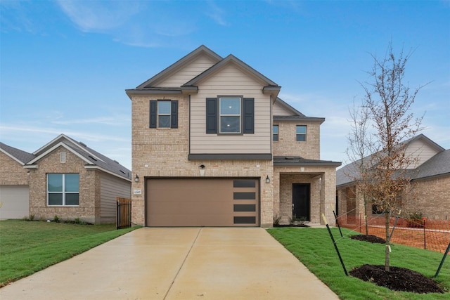 view of front of house featuring a garage and a front lawn