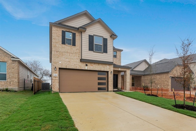 view of front of property featuring a garage and a front yard