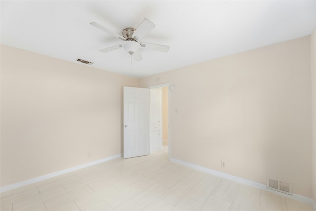 unfurnished room with ceiling fan