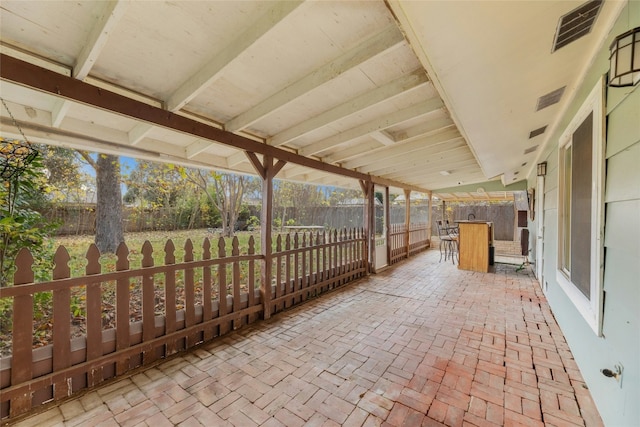 view of patio featuring an outdoor bar