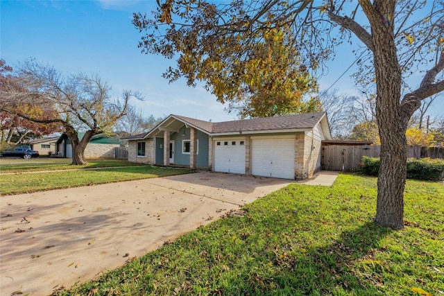 ranch-style house featuring a front yard and a garage