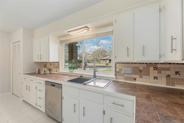 kitchen with decorative backsplash, white cabinetry, dishwasher, and sink