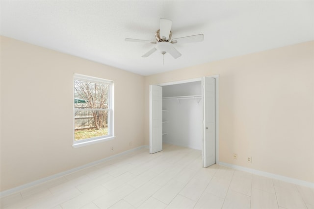 unfurnished bedroom with a closet and ceiling fan