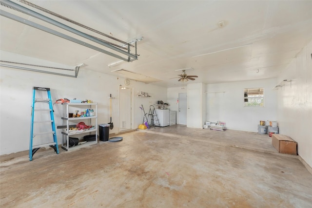 garage featuring washer and dryer and ceiling fan