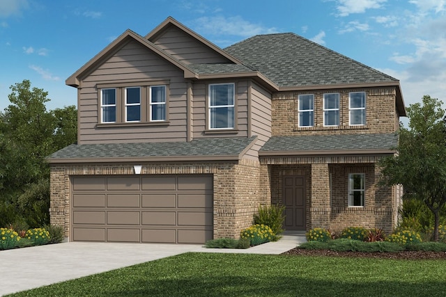 view of front of home with a garage and a front lawn