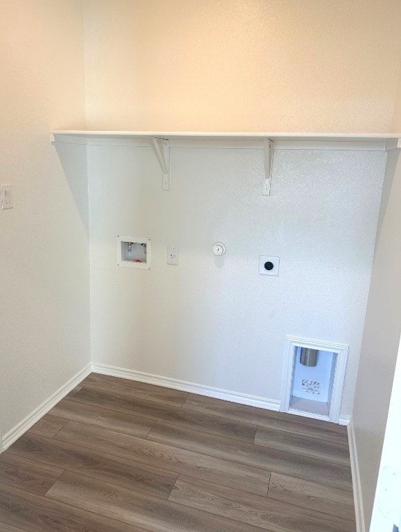 laundry area with dark wood-style floors, hookup for a washing machine, hookup for an electric dryer, gas dryer hookup, and laundry area