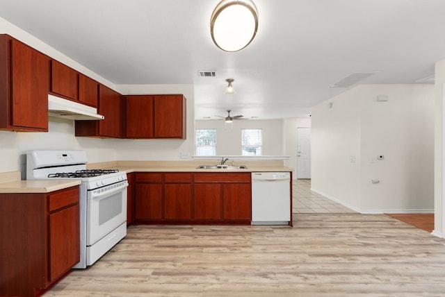 kitchen with white appliances, light hardwood / wood-style floors, ceiling fan, and sink