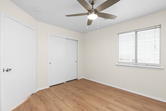 unfurnished bedroom featuring a closet, ceiling fan, and light hardwood / wood-style floors