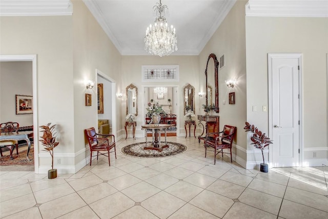 tiled entrance foyer with a high ceiling, ornamental molding, and a notable chandelier