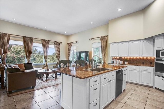 13628 Gregg Manor Rd, Manor, TX 78653 - kitchen featuring a sink, appliances with stainless steel finishes, a center island with sink, light tile patterned flooring, and recessed lighting