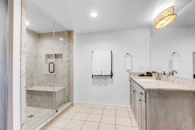 13628 Gregg Manor Rd, Manor, TX 78653 - bathroom featuring baseboards, double vanity, tile patterned flooring, a stall shower, and recessed lighting