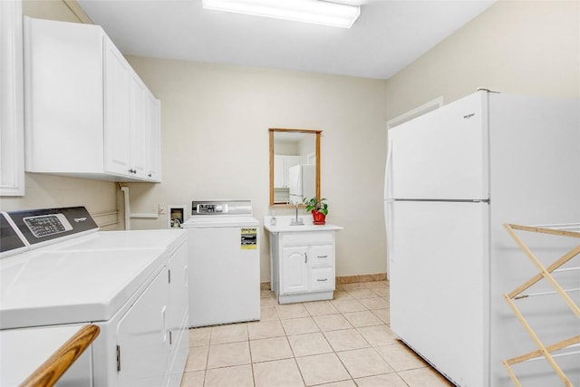 13628 Gregg Manor Rd, Manor, TX 78653 - laundry room with washer and dryer, light tile patterned floors, and baseboards