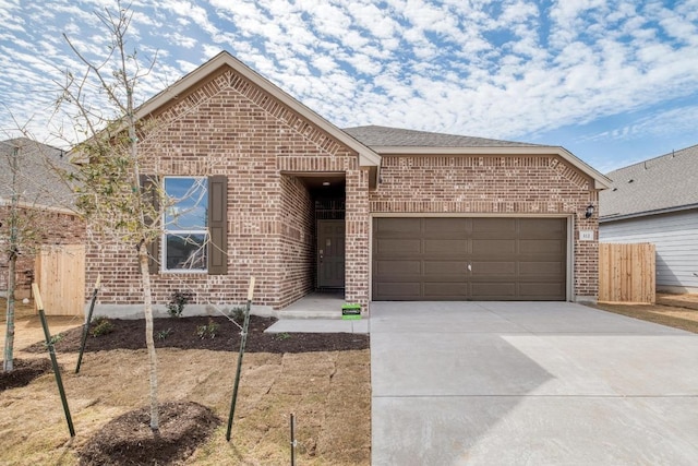 single story home featuring brick siding, roof with shingles, concrete driveway, fence, and a garage