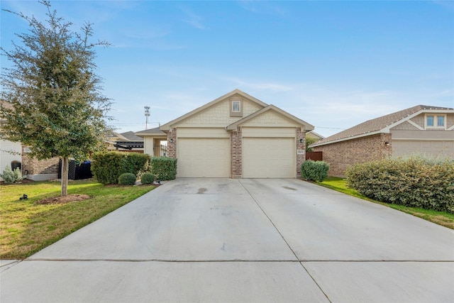 view of front facade with a garage and a front yard