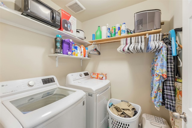 laundry area with washing machine and clothes dryer