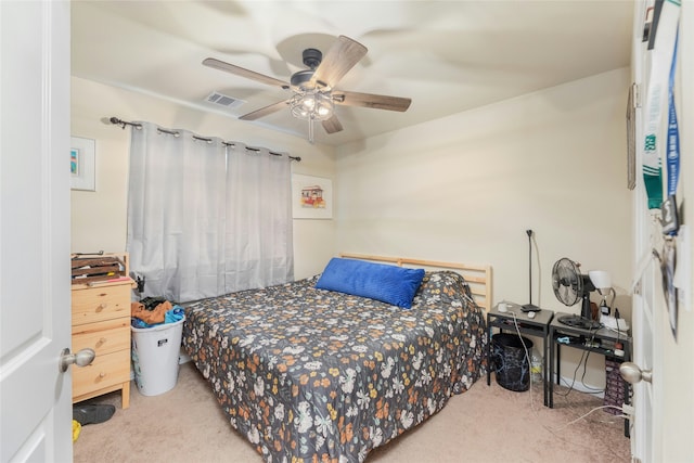 bedroom featuring ceiling fan and carpet