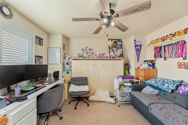 office area featuring ceiling fan and light carpet