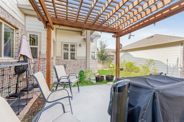 view of patio featuring a pergola and a grill