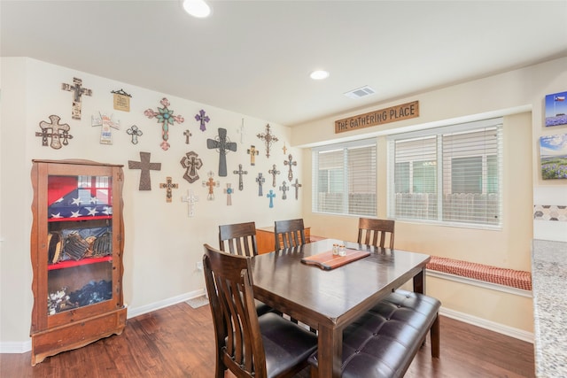 dining room featuring dark hardwood / wood-style flooring