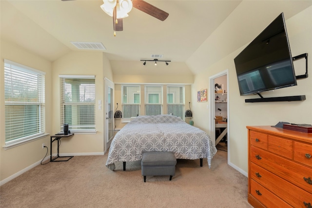 bedroom with light carpet, ceiling fan, lofted ceiling, and multiple windows