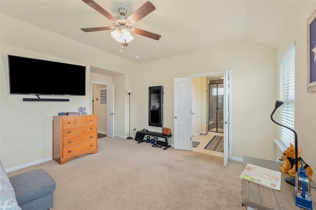 interior space with light carpet, ceiling fan, and lofted ceiling