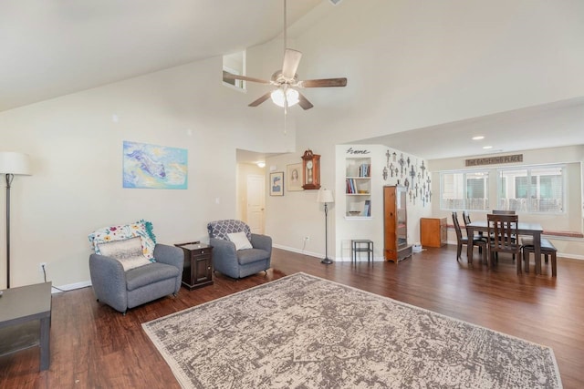 living room featuring ceiling fan, dark hardwood / wood-style flooring, and high vaulted ceiling