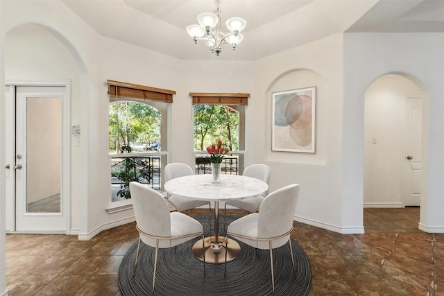 dining space with a notable chandelier