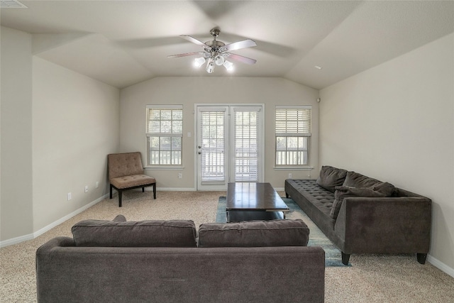 carpeted living room featuring ceiling fan and vaulted ceiling