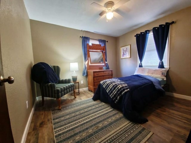 bedroom featuring ceiling fan and dark hardwood / wood-style floors