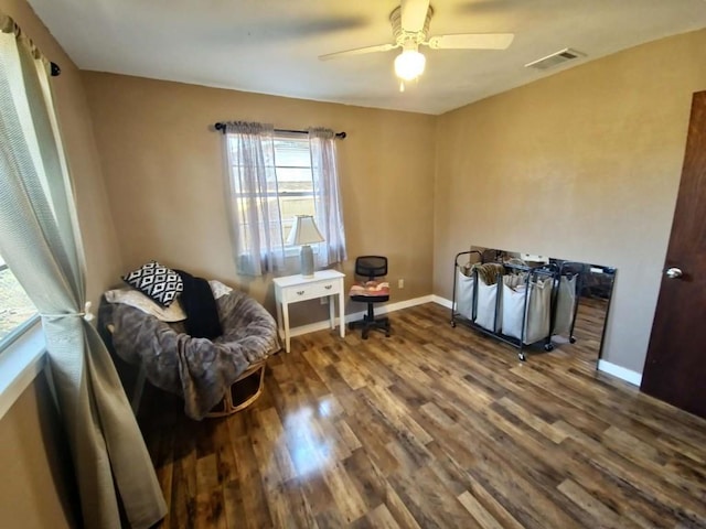 sitting room with wood-type flooring and ceiling fan