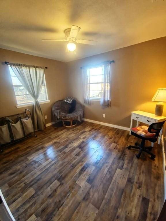 unfurnished room featuring ceiling fan and dark wood-type flooring