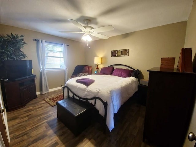 bedroom featuring ceiling fan and dark hardwood / wood-style flooring