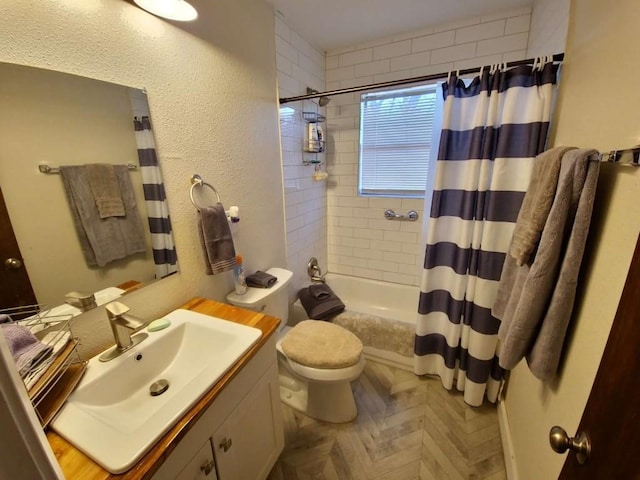 full bathroom featuring shower / tub combo, vanity, and toilet