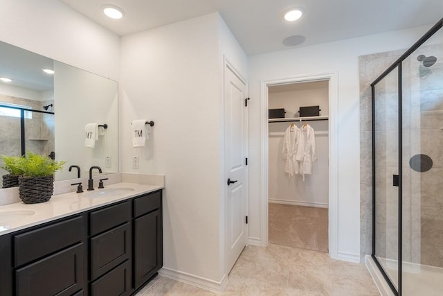 bathroom with tile patterned floors, vanity, and a shower with shower door