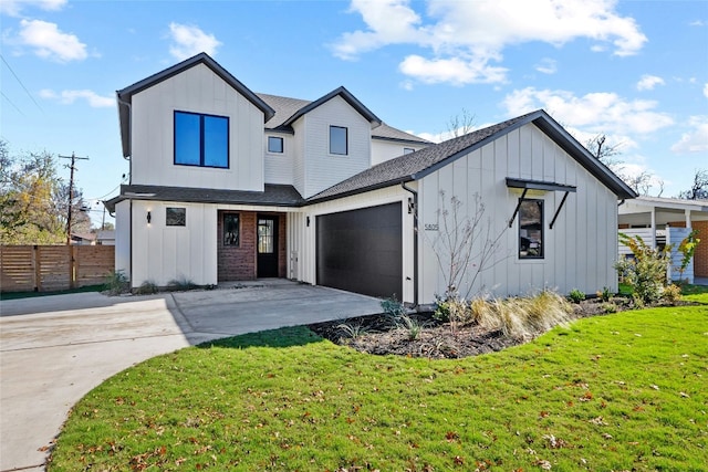 modern inspired farmhouse with a garage and a front yard