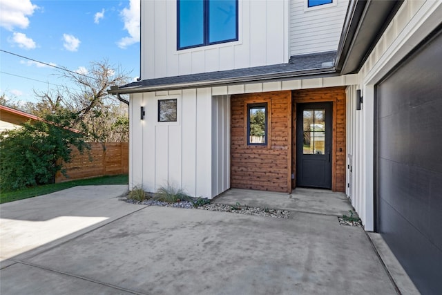 view of exterior entry featuring a patio area