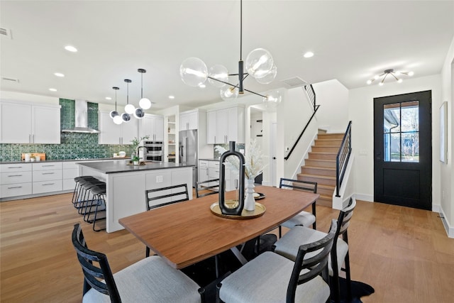 dining space featuring light hardwood / wood-style flooring