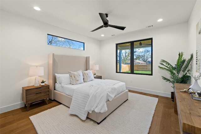 bedroom featuring wood-type flooring and ceiling fan